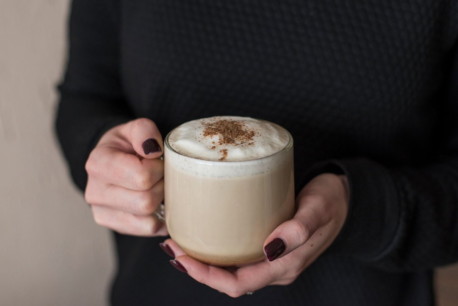 Hands wrapped around a warm cup